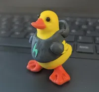 A yellow clay duck with a Hylo hoodie.